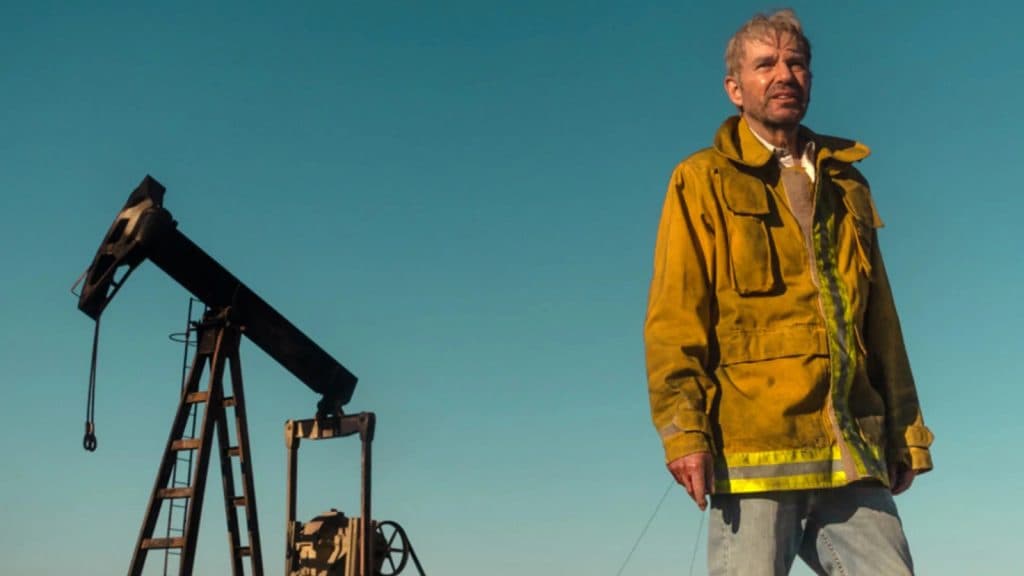 Landman review: Billy Bob Thornton as Tommy Norris standing by an oil rig