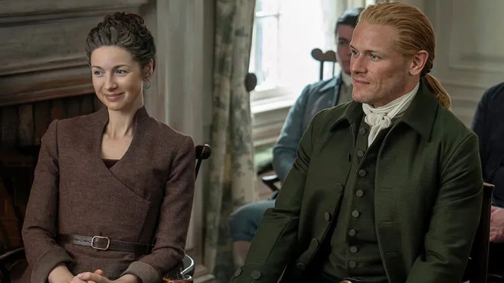 Claire and Jamies sitting together in Outlander.