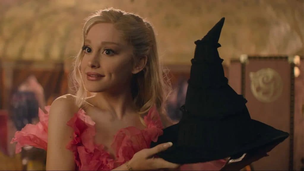 Glinda holds the witches hat in Wicked