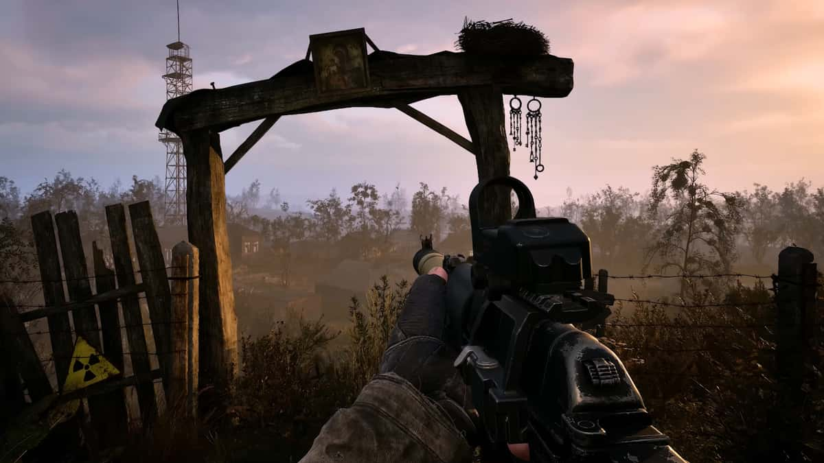 A player exploring Ukraine's wildlands in Stalker 2: Heart of Chornobyl with a rifle in hand.