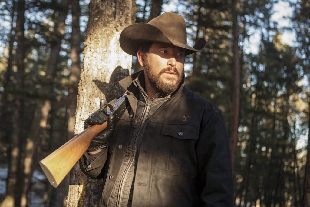 Yellowstone: Cole Hauser as Rip holding a gun