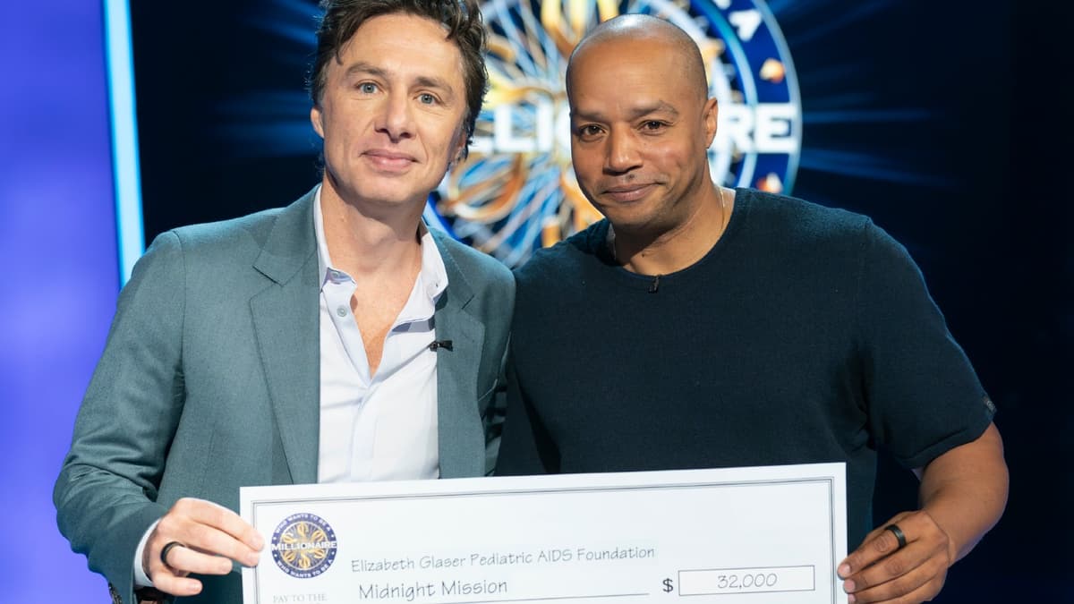 Zach Braff and Donald Faison with large check at Who Wants To Be A Millionaire