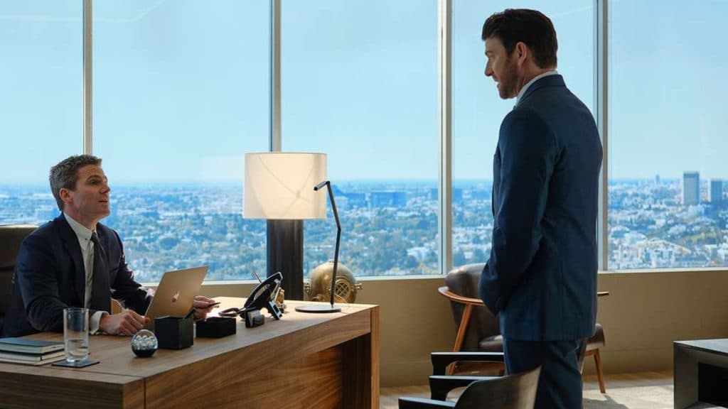 Bryan Greenberg standing in an office in Suits LA.