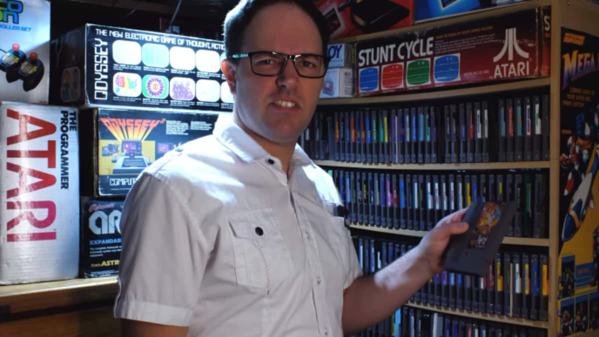 james rolfe holding new angry video game nerd 8-bit game