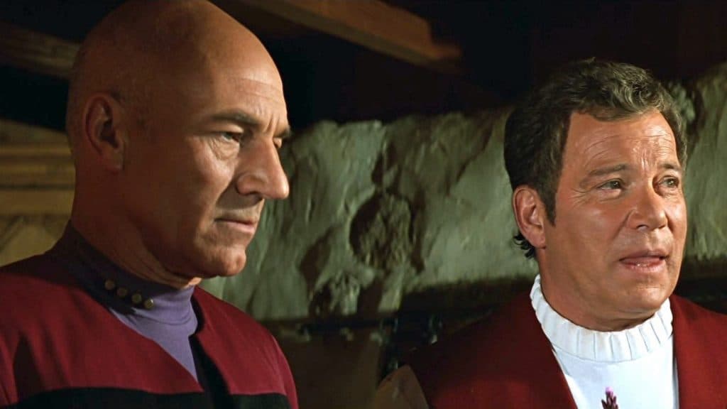 Captain Picard and Captain Kirk stand side by side