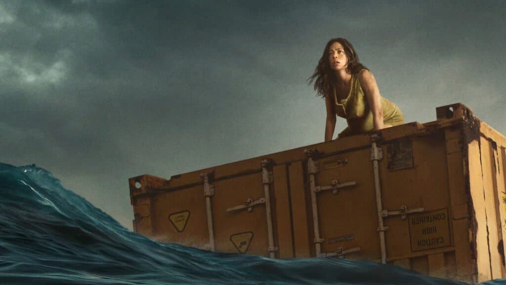 Ana Castillo on a crate in the ocean in Nowhere