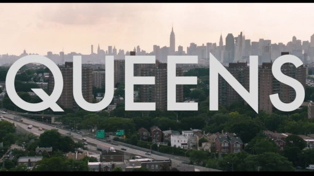 The name Queens superimposed over New York City