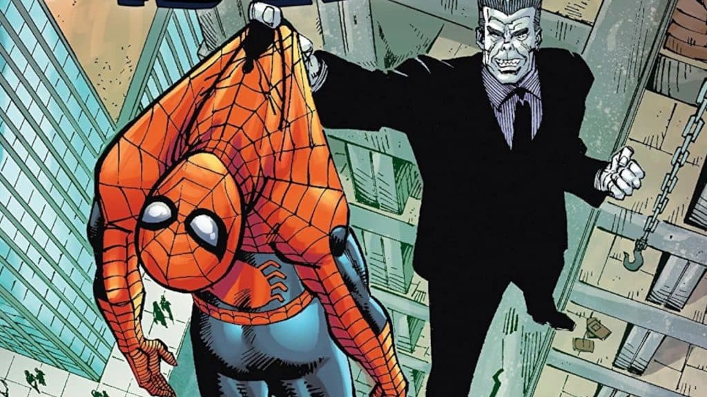 A man with a ghoulsh pale face holds Spider-man off the edge of a building.