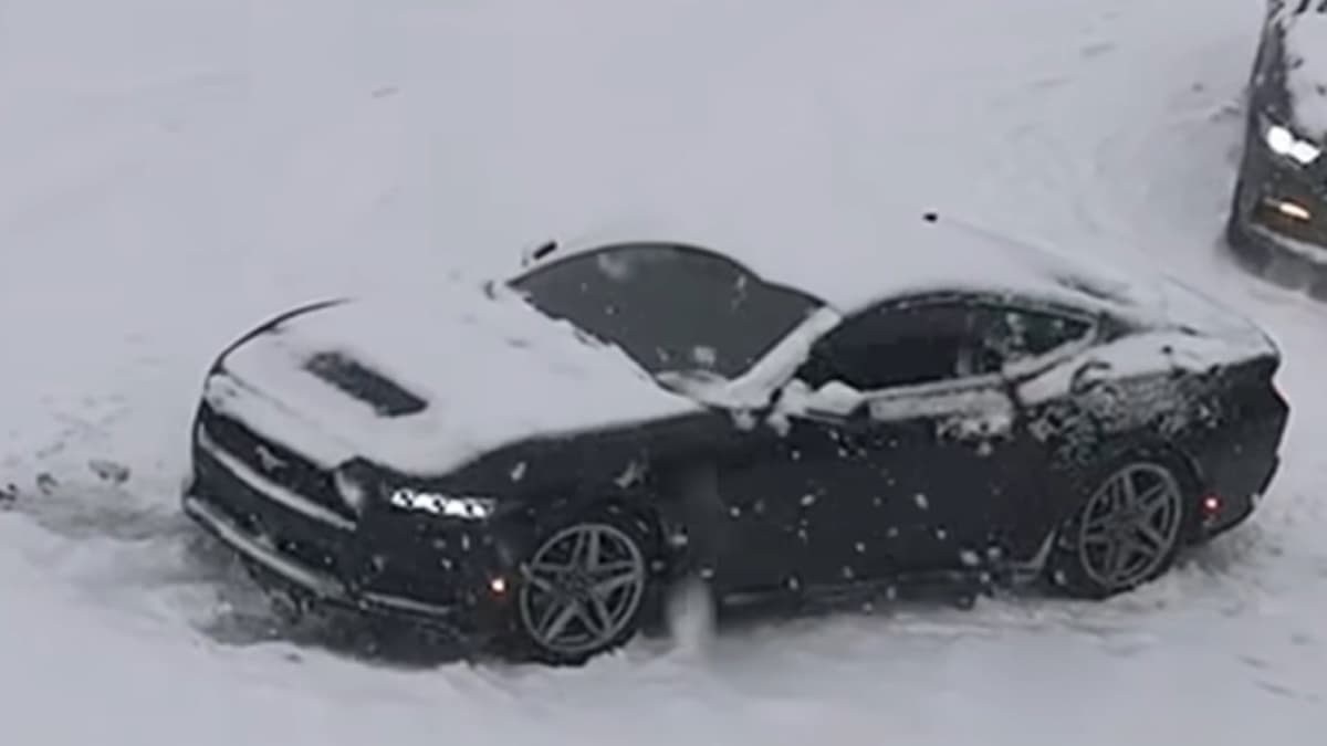 man sues baby to clear snow off car