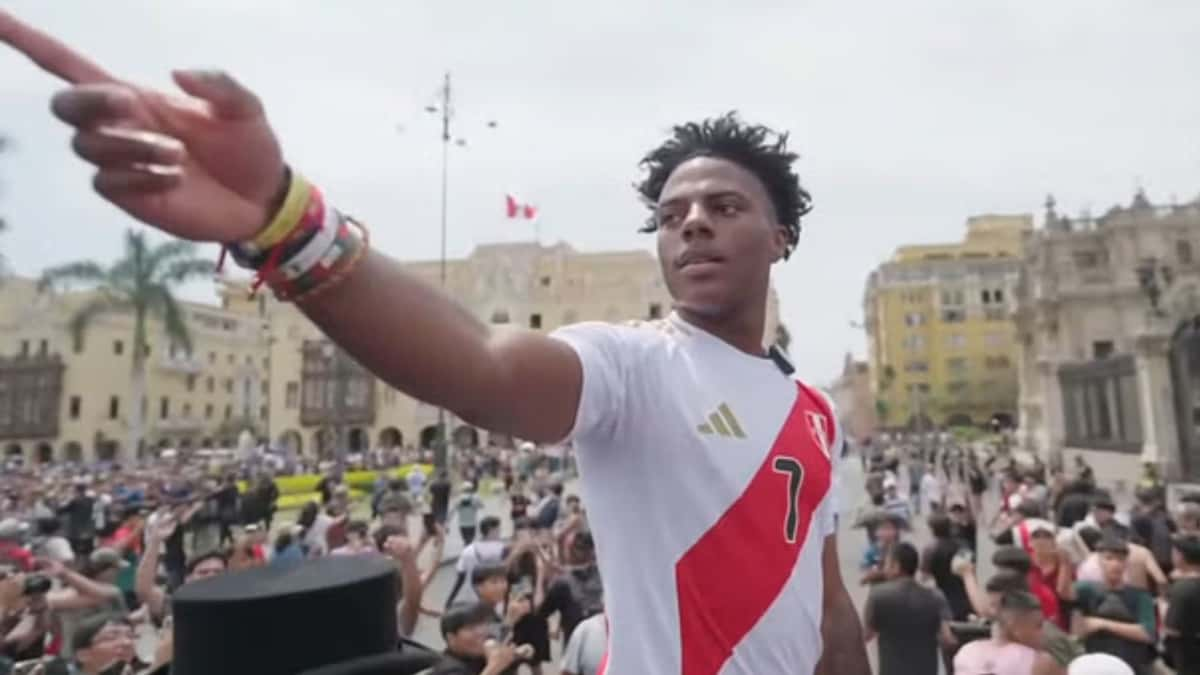 Ishowspeed pointing at crowd in Peru football shirt