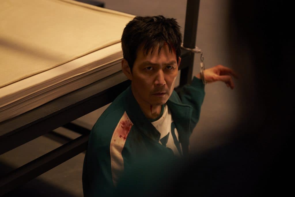 Lee Jung-jae as Sung Gi-hun, chained to a bed in Squid Game 3.