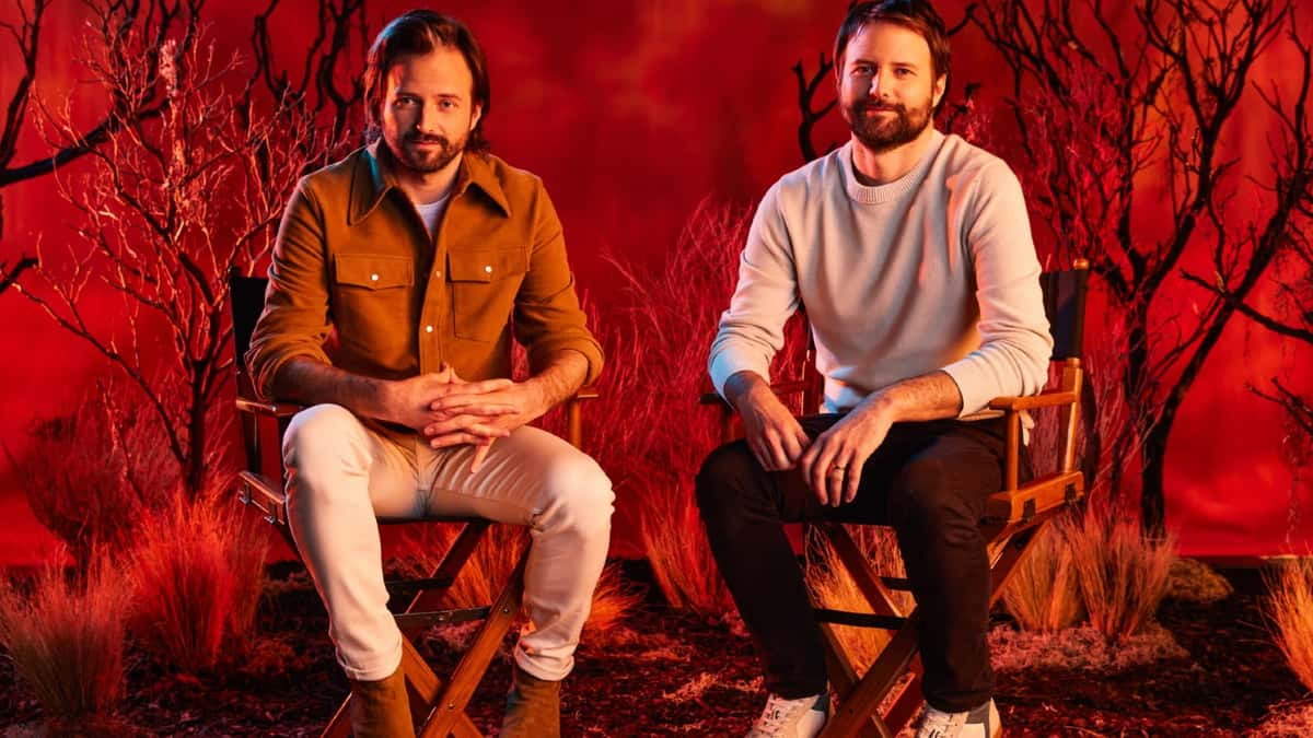 The Duffer brothers sitting in director's chairs.