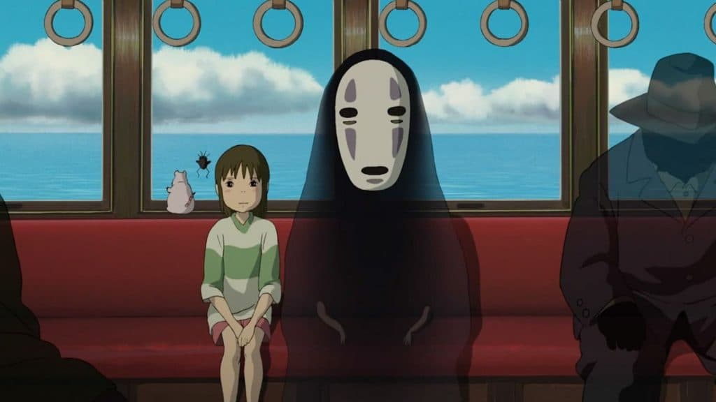 Chihiro and No Face ride the train in Spirited Away