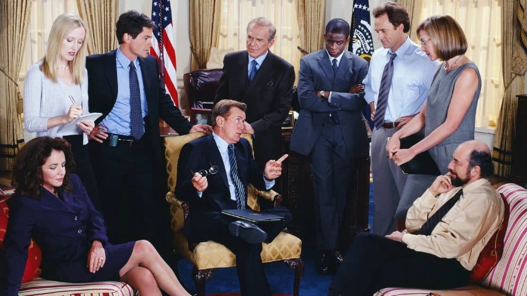 The cast of The West Wing in the Oval Office