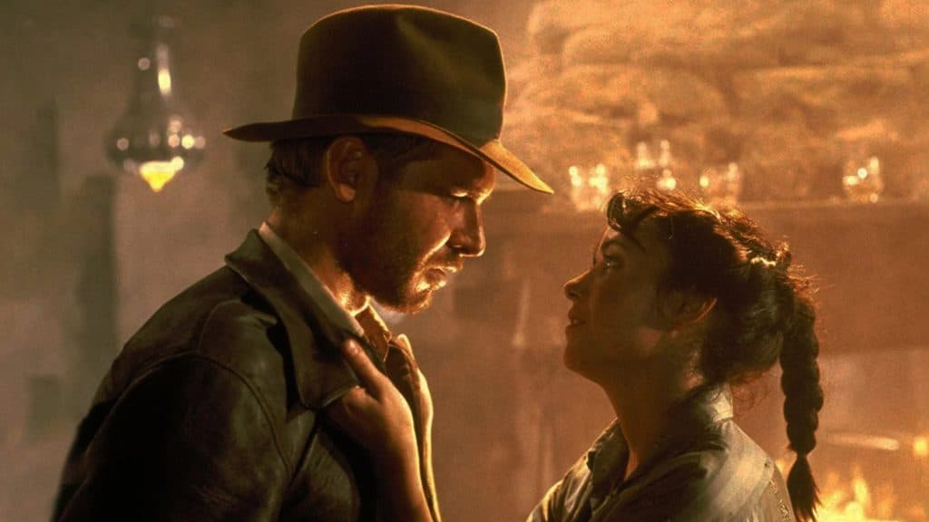 Marion looking into the eyes of Indiana Jones.