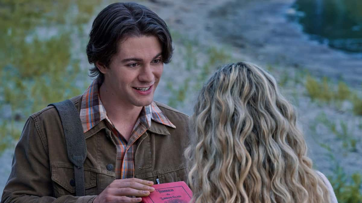 Colton shows Evelyn a book in The Way Home Season 3